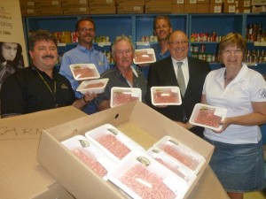 From left to right:  Myles Vanni, from Inn of the Good Shepherd, Peter Zantingh, Farmer Lyle Hendrikx (front), Brad Zantingh, Sarnia-Lambton MPP Bob Bailey, Farmer Mary Ann Hendrikx with some of the donated product. 